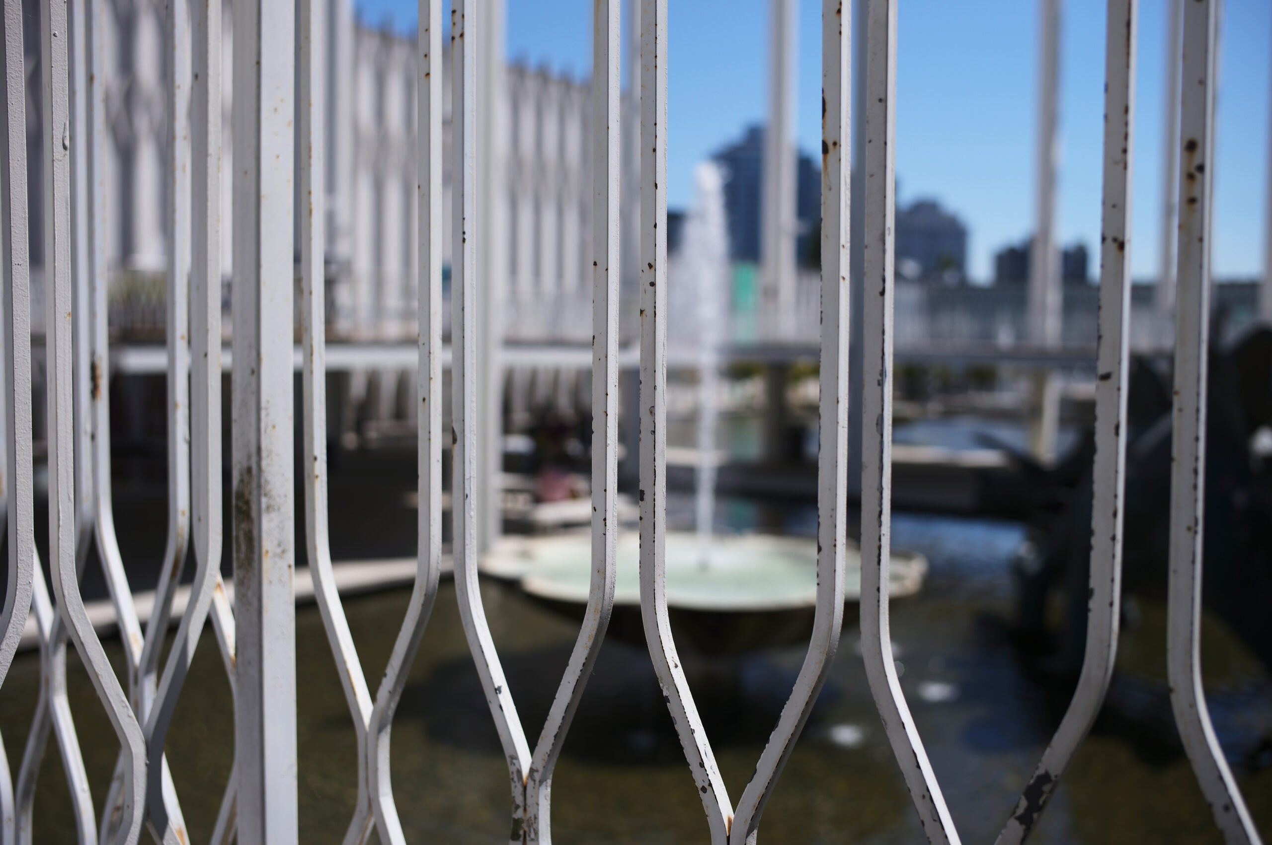 A white iron fence.